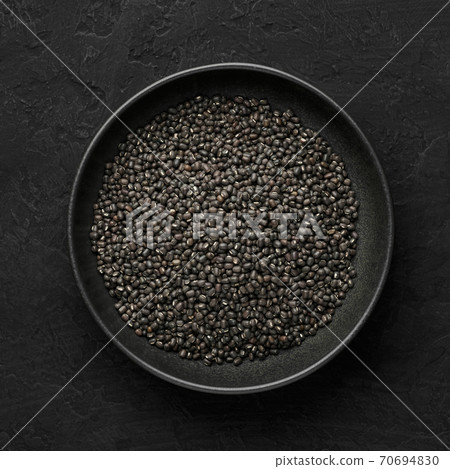 Black Gram or Urad Beans or Mung Beans in bowl on dark slate table top. Indian cuisine food Black Gram or Urad Beans or Mung Beans in bowl on dark slate table top. Indian cuisine food 70694830