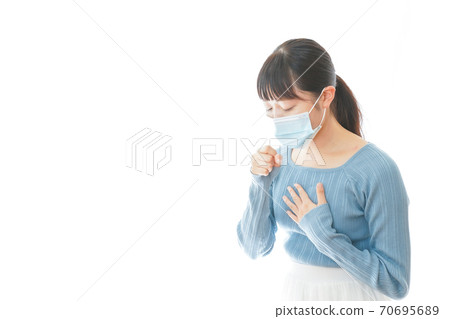 Young woman wearing a mask with coughing symptoms Young woman wearing a mask with coughing symptoms 70695689