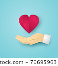 Red Heart on Human hand on blue background. Vector illustration. 70695963