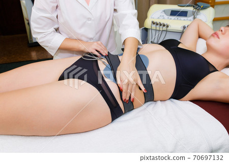 Myostimulation of abdominal muscles for weight loss. 70697132