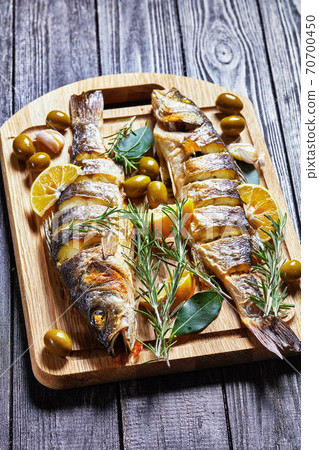 Roasted seabass with olives and tartar sauce Roasted seabass with olives and tartar sauce 70700450