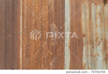 Metal steel strips. Rusty corrugated iron metal, Zinc steel wall, pattern texture background. Close-up of exterior architecture material for design decoration background. Metal steel strips. Rusty corrugated iron metal, Zinc steel wall, pattern texture background. Close-up of exterior architecture material for design decoration background. 70700789