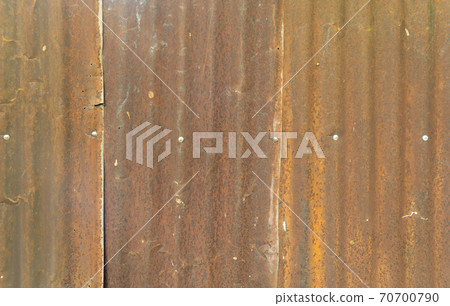 Metal steel strips. Rusty corrugated iron metal, Zinc steel wall, pattern texture background. Close-up of exterior architecture material for design decoration background. Metal steel strips. Rusty corrugated iron metal, Zinc steel wall, pattern texture background. Close-up of exterior architecture material for design decoration background. 70700790