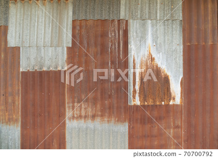 Metal steel strips. Rusty corrugated iron metal, Zinc steel wall, pattern texture background. Close-up of exterior architecture material for design decoration background. Metal steel strips. Rusty corrugated iron metal, Zinc steel wall, pattern texture background. Close-up of exterior architecture material for design decoration background. 70700792