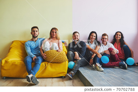 Group portrait of multi-ethnic boys and girls with colorful fashionable clothes holding friend and posing on a brick wall, Urban style people having fun, Concepts about youth and lifestyle Group portrait of multi-ethnic boys and girls with colorful fashionable clothes holding friend and posing on a brick wall, Urban style people having fun, Concepts about youth and lifestyle 70702788