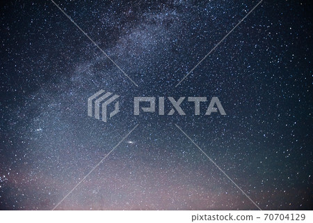 Vibrant night sky with stars and nebula and galaxy. Deep sky astrophoto 70704129
