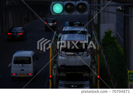 Vehicle carrier passing through an intersection 70704871