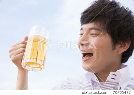 Male drinking beer Male drinking beer 70705472
