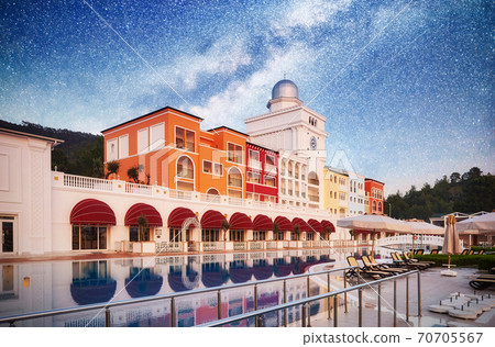 TEKIROVA TURKEY - APRIL 25 2017: Swimming pool and beach of luxury hotel. Type entertainment complex. Amara Dolce Vita Luxury Hotel. Resort. Tekirova-Kemer. Turkey TEKIROVA TURKEY - APRIL 25 2017: Swimming pool and beach of luxury hotel. Type entertainment complex. Amara Dolce Vita Luxury Hotel. Resort. Tekirova-Kemer. Turkey 70705567