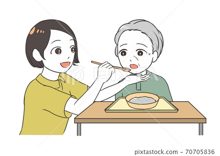 Female caregiver assisting elderly women with meals Female caregiver assisting elderly women with meals 70705836