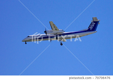 Passenger plane landing with the blue sky Passenger plane landing with the blue sky 70706476
