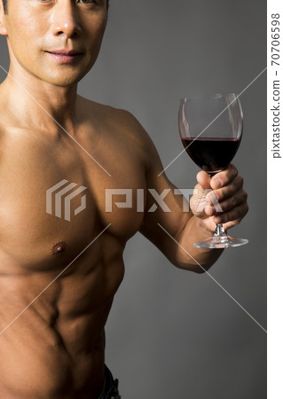 Macho man with a wine glass Macho man with a wine glass 70706598