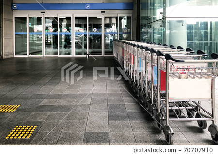 Trolley in front of The airport Trolley in front of The airport 70707910