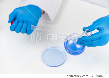 Researcher researching and developing potions Researcher researching and developing potions 70708608