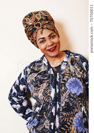 beauty bright african woman with creative make up, shawl on head like cubian closeup smiling beauty bright african woman with creative make up, shawl on head like cubian closeup smiling 70708651