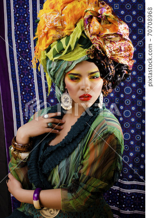 beauty bright woman with creative make up, many shawls on head like cubian, ethno look closeup beauty bright woman with creative make up, many shawls on head like cubian, ethno look closeup 70708968