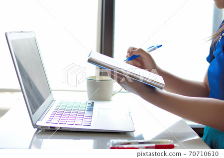 Woman working at home 70710610