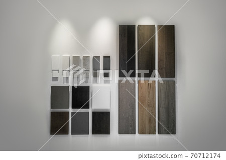 Interior design choice of condo finishes for kitchen cabinets, countertop and floor. Quartz and hardwood flooring samples at home improvement store showroom house remodeling renovation stone surfaces 70712174