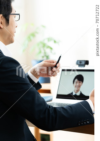 Men having an online meeting 70712722