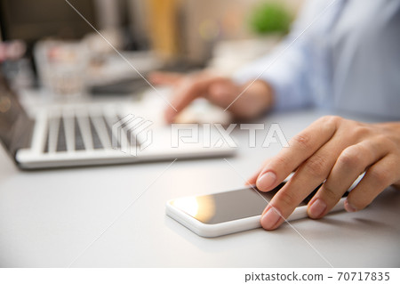 Remote working from home. Workplace in home office with PC, devices and gadgets. Remote working from home. Workplace in home office with PC, devices and gadgets. 70717835