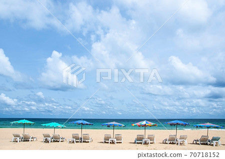 Turquoise blue sea, blue sky and colourful beach umbrellas at Kata beach in phuket. Thailand 70718152