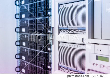Cluster of data storage hard drives inside server room 70718209