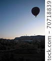 Silhouette of a balloon floating in the sky of Cappadocia at dawn 70718839