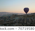 Cappadocia skyline and balloons in the early morning 70719580