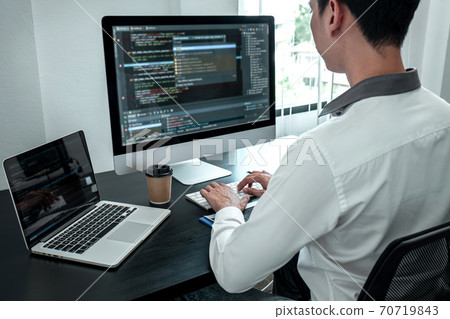 Young Programmer working in software javascript computer in IT office, Writing codes and data code website and coding database technologies to find solution to problem 70719843