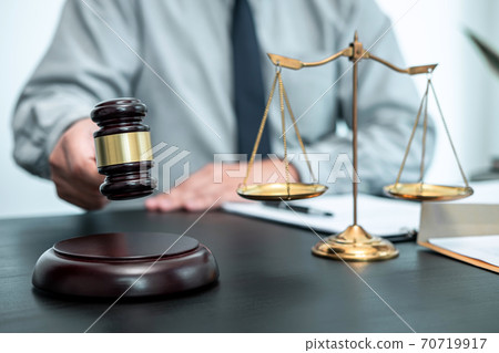 Male lawyer working with legal case document contract in office, law and justice, attorney, lawsuit concept 70719917