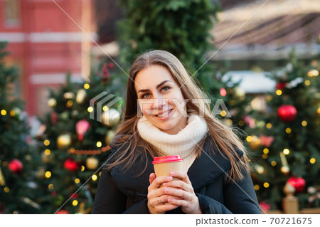 Girl walking at christmas market Girl walking at christmas market 70721675