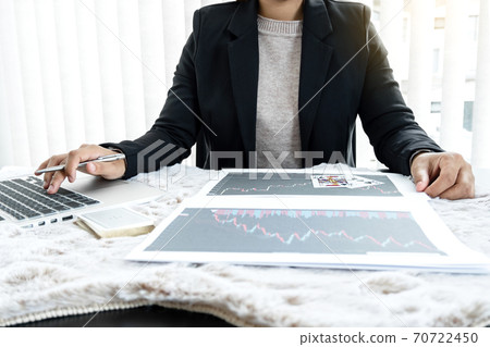 The girl's hand is a stockbroker who holds cards and plans a business investment by analyzing and calculating the stock market to find market profits The girl's hand is a stockbroker who holds cards and plans a business investment by analyzing and calculating the stock market to find market profits 70722450