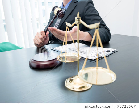 A professional male lawyer who works at a law firm has scales, Scales of justice, documents about justice, and lawsuits. Concepts of law and justice A professional male lawyer who works at a law firm has scales, Scales of justice, documents about justice, and lawsuits. Concepts of law and justice 70722567