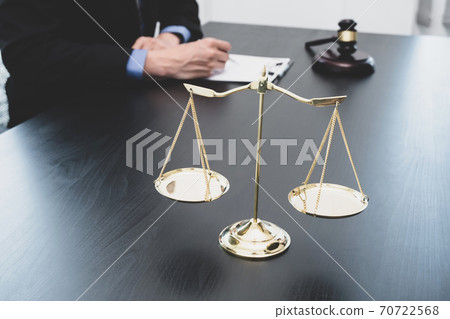 Professional male lawyers work at a law office There are scales, Scales of justice, judges gavel, and litigation documents. Concepts of law and justice Professional male lawyers work at a law office There are scales, Scales of justice, judges gavel, and litigation documents. Concepts of law and justice 70722568