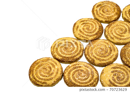 round cookies sprinkled with sugar, round cookies, curled cookies with sugar 70723629