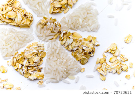 oatmeal and rice on a white background, rice and porridge, snowflake of rice and oatmeal, flower of cereals 70723631