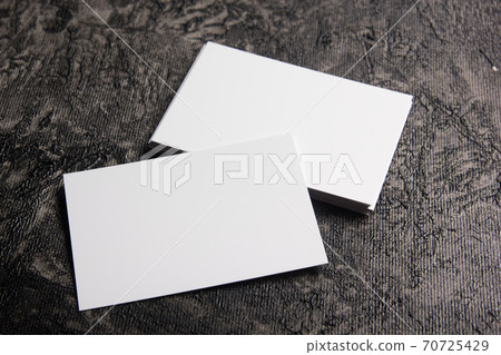 Business card blank on wooden background. Corporate Stationery, Branding Mock-up. Creative designer desk. Flat lay. Copy space for text Business card blank on wooden background. Corporate Stationery, Branding Mock-up. Creative designer desk. Flat lay. Copy space for text 70725429