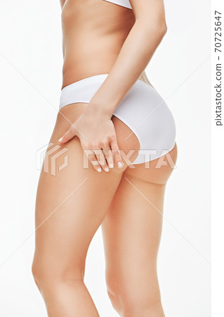 woman's booty close-up isolated on white background woman's booty close-up isolated on white background 70725647
