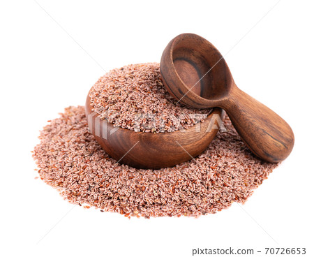Plantago ovata seeds, isolated on white background. Plantain, indian flea or psyllium seeds in wooden bowl and spoon. Plantago ovata seeds, isolated on white background. Plantain, indian flea or psyllium seeds in wooden bowl and spoon. 70726653