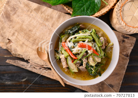 Northern Thai food, Spicy curry soup with pork and mixed local vegetables 70727813