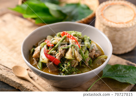 Northern Thai food, Spicy curry soup with pork and mixed local vegetables 70727815