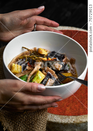 pasta pizzoccheri with chinese cabbage, potato on dark background. italian traditional dish 70729013