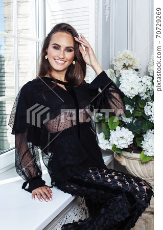 young pretty lady in black lace fashion style dress posing in rich interior of royal hotel room, luxury lifestyle people concept young pretty lady in black lace fashion style dress posing in rich interior of royal hotel room, luxury lifestyle people concept 70729269