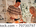 The happy man fills a wine glass 70730797