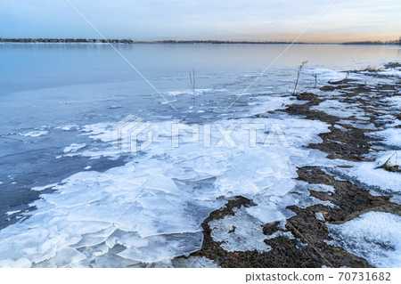 dusk over frozen lake in northern Colorado dusk over frozen lake in northern Colorado 70731682