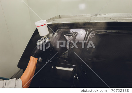 Worker painting a car in a paint booth, Worker painting a car in a paint booth, 70732588