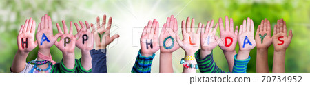 Children Hands Building Word Happy Holidays, Grass Meadow Children Hands Building Word Happy Holidays, Grass Meadow 70734952