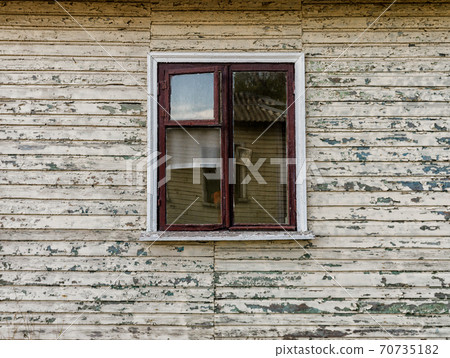 walls and window of an old abandoned village wooden house in Ukraine 70735182