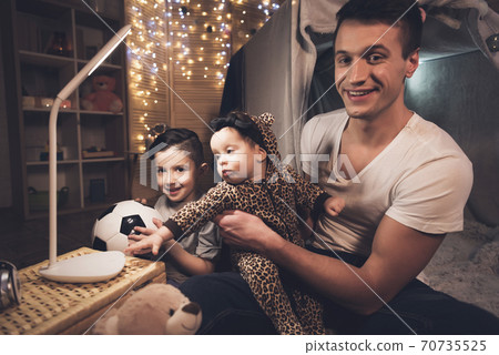 Father and son are playing with little baby sister 70735525
