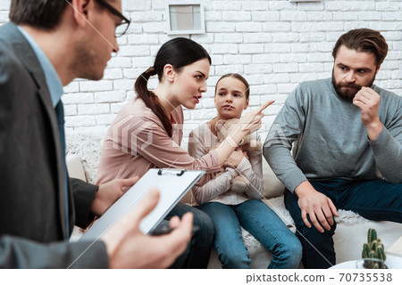 Evil woman reproaches young man in office. Evil woman reproaches young man in office. 70735538